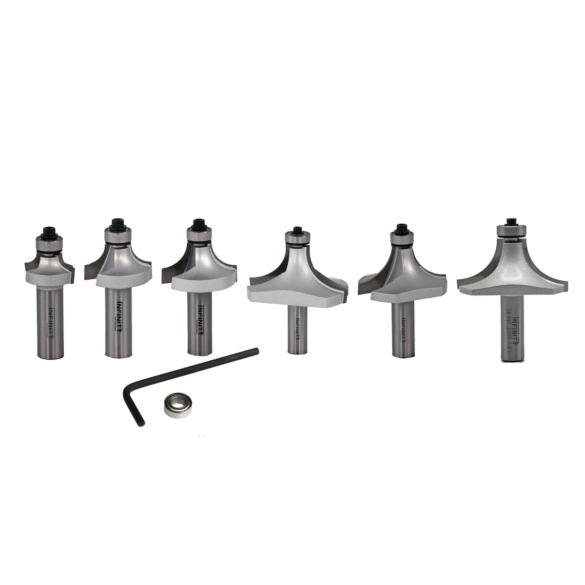 Set of six round over router bits with hex key and bearing on white background