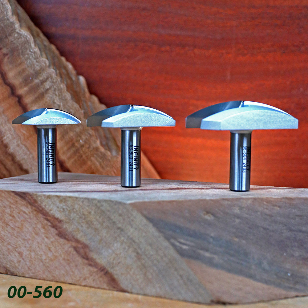 Three woodworking router bits with roundover carbide tips displayed on wood blocks