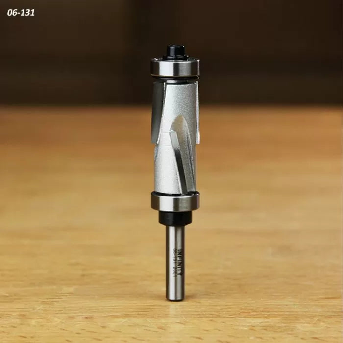Flush trim router bit with dual bearings on a wooden surface, woodworking tool close-up