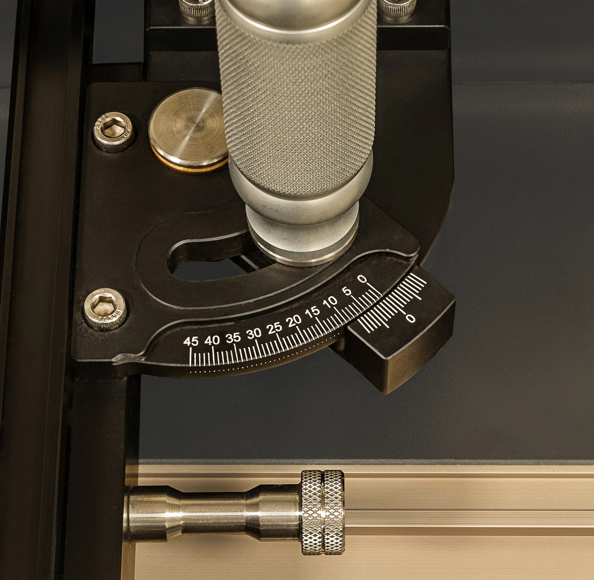 Precision woodworking tool with angle adjustment dial and metal handle, close-up