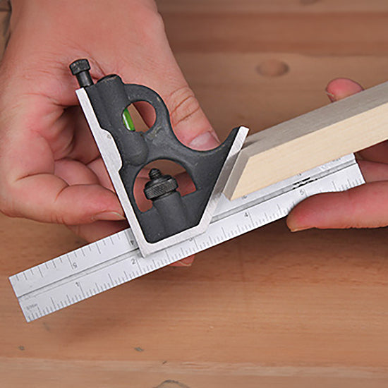 Woodworker using a combination square to measure a precise angle on a piece of wood