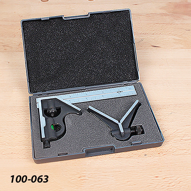 Combination square and protractor set in foam-lined case on wood surface
