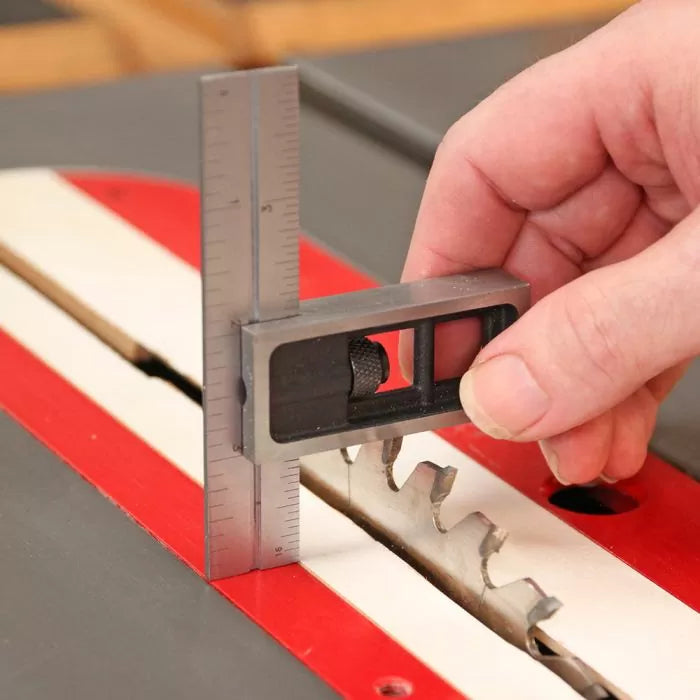 Measuring table saw blade height with precision square for woodworking setup