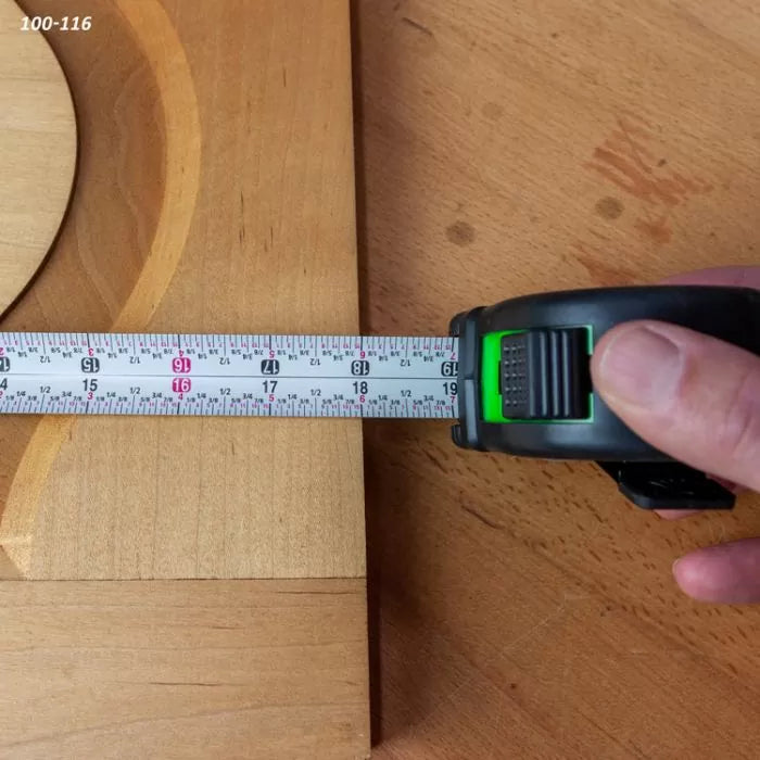 Measuring a wooden board with a tape measure for woodworking precision