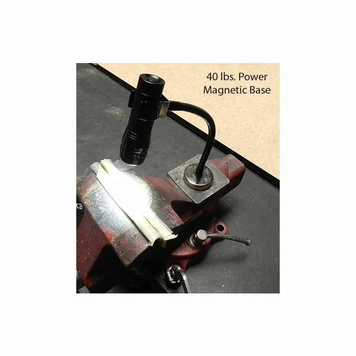 Magnetic base LED work light with flexible neck attached to a metal vise on a workbench.