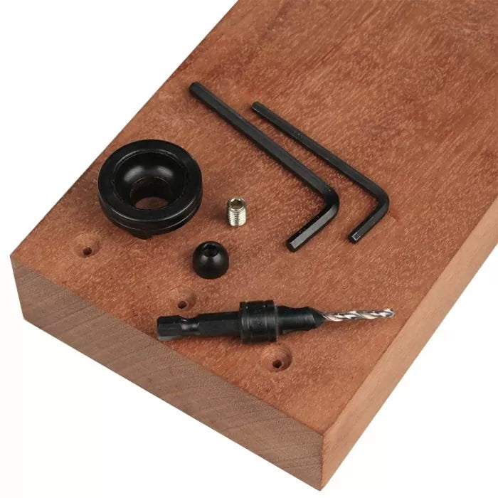 Pocket hole drill bit set with hex wrenches and stop collar on a wood block