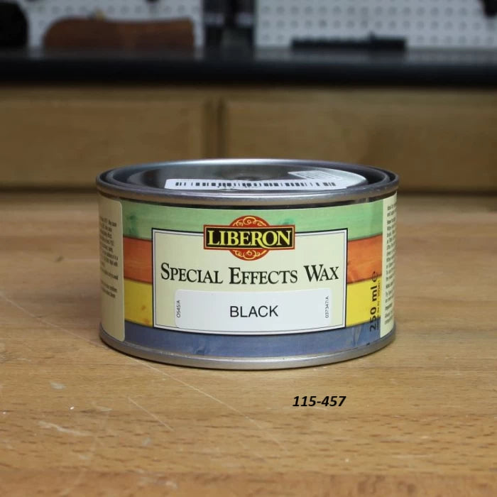 Liberon Special Effects Wax Black 250ml can on a woodworking bench