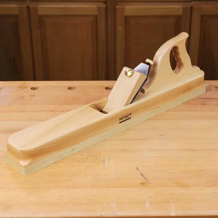 Wooden jointer hand plane for woodworking on a workbench, ideal for smoothing surfaces