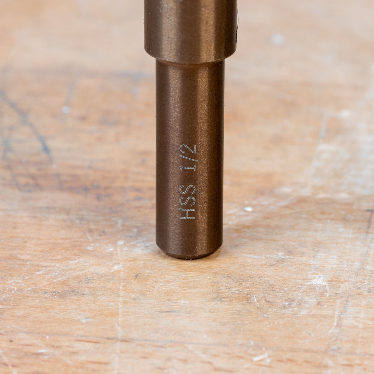 Closeup of HSS 1/2 marking on metal woodworking tool shank on a workbench