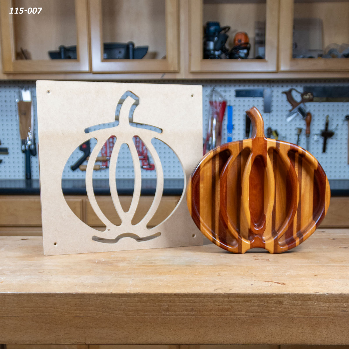 Pumpkin tray woodworking template and finished wooden pumpkin-shaped serving tray on workbench