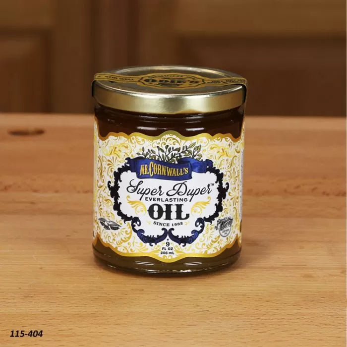 Jar of Mr. Cornwall's Super Duper Everlasting Oil on a woodworking table