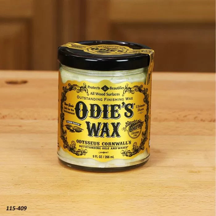 Odie's Wax jar for wood finishing on a wooden surface, woodworking tool accessory