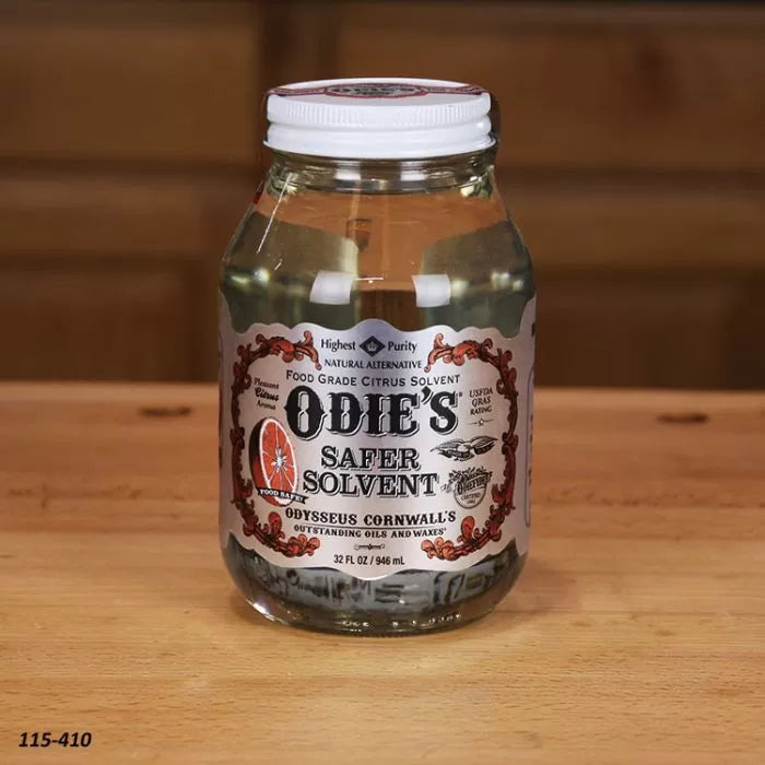 Odie's Safer Solvent 32 oz jar on wooden table, food grade citrus wood finish solvent