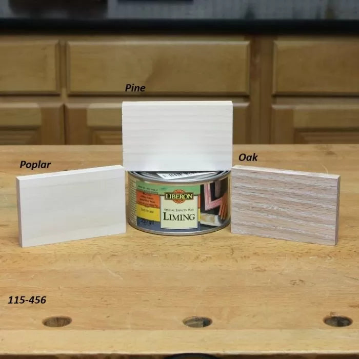 Liming wax on pine, poplar, and oak wood samples displayed on a woodworking bench.