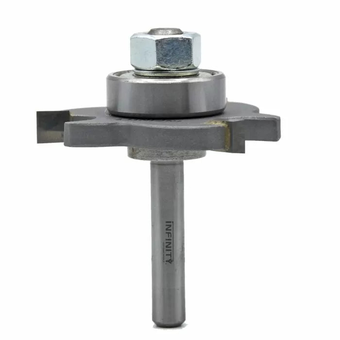 Carbide woodworking router bit with ball bearing and nut on white background