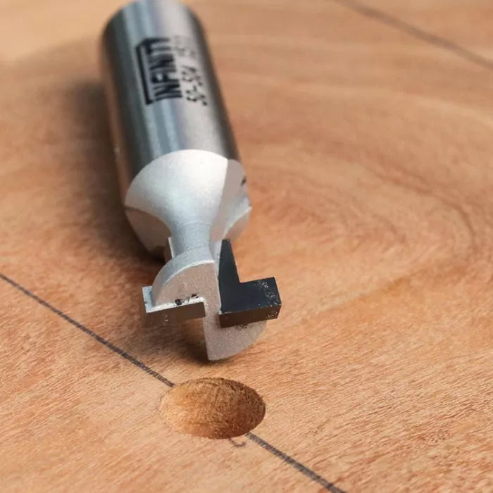 Slot cutting router bit on wood surface for precise woodworking joinery