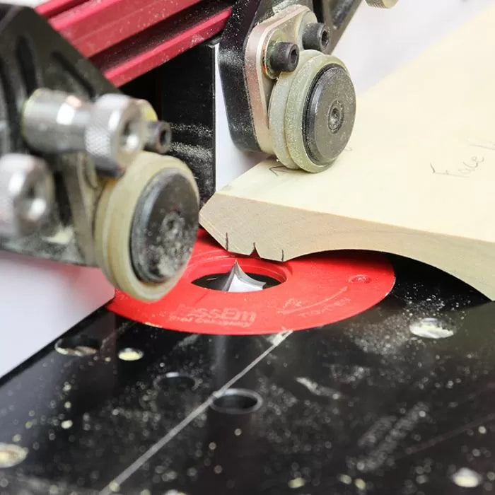 Close-up of a woodworking router table cutting decorative edge on wood