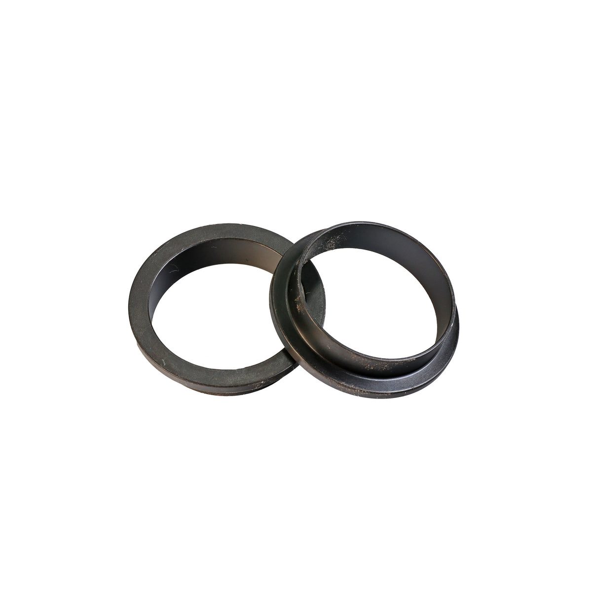 Two black plastic router table insert rings for woodworking dust collection