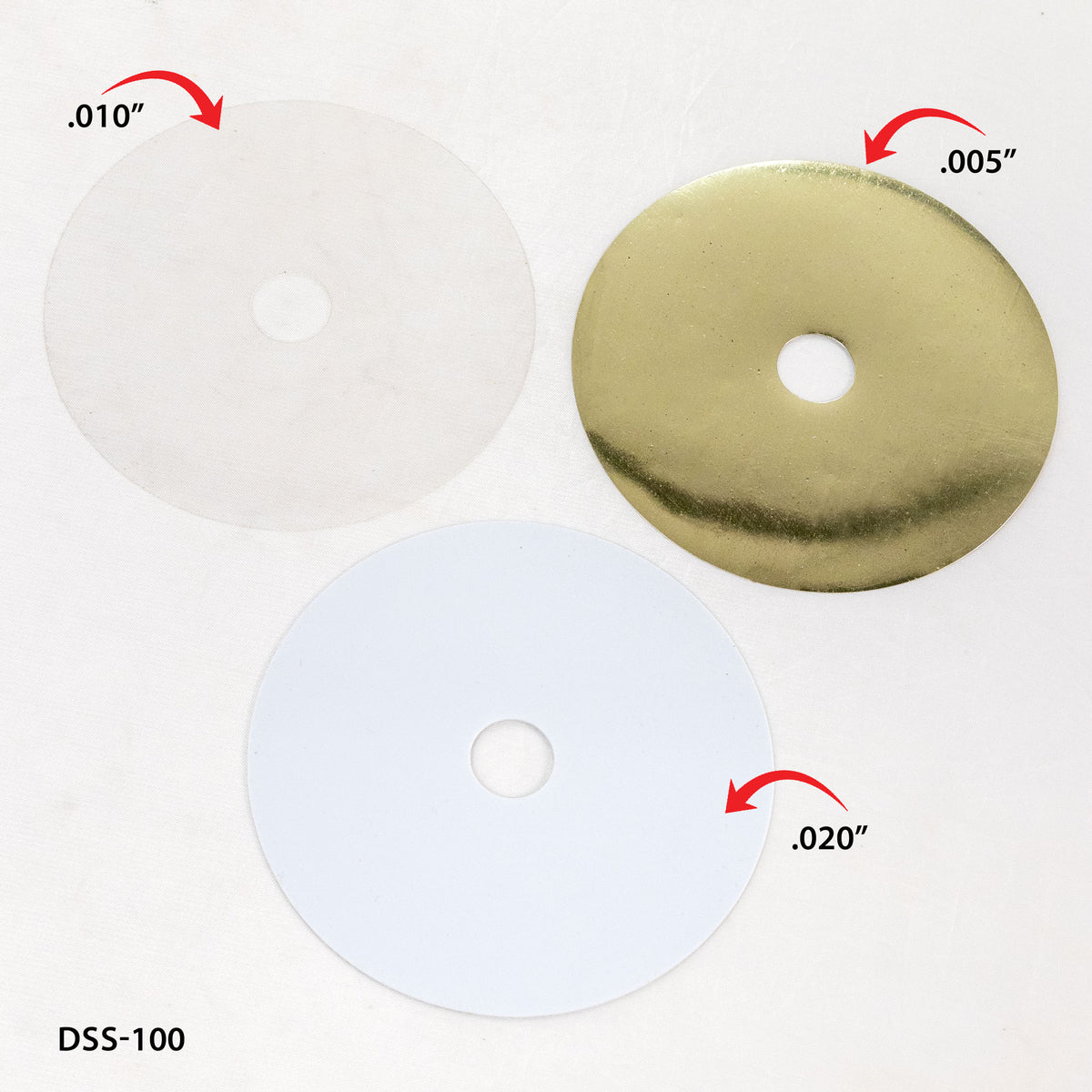 Three dado blade shims on a white background with thicknesses marked.