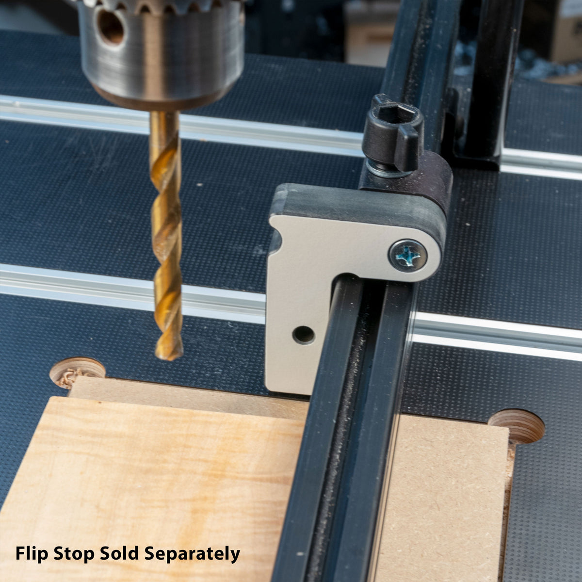 Drill press with flip stop fence for woodworking, flip stop accessory sold separately.