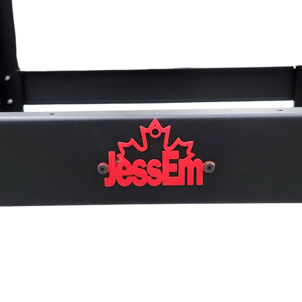 Close-up of a black metal woodworking stand with a red JessEm logo and maple leaf design.