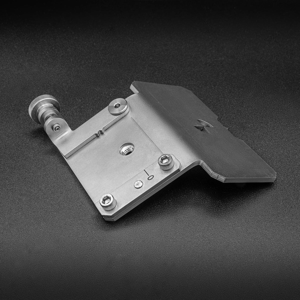 Adjustable metal miter gauge jig for woodworking, precision tool on a black surface