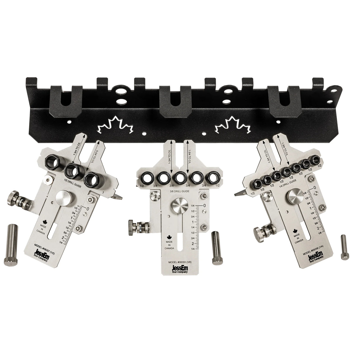 Precision woodworking doweling jig set with metal guides and wall-mounted holder.