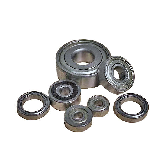 Assorted metal ball bearings for woodworking tools on white background