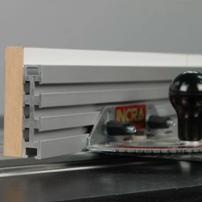 Aluminum router table fence with MDF face and black adjustment knob, woodworking tool detail