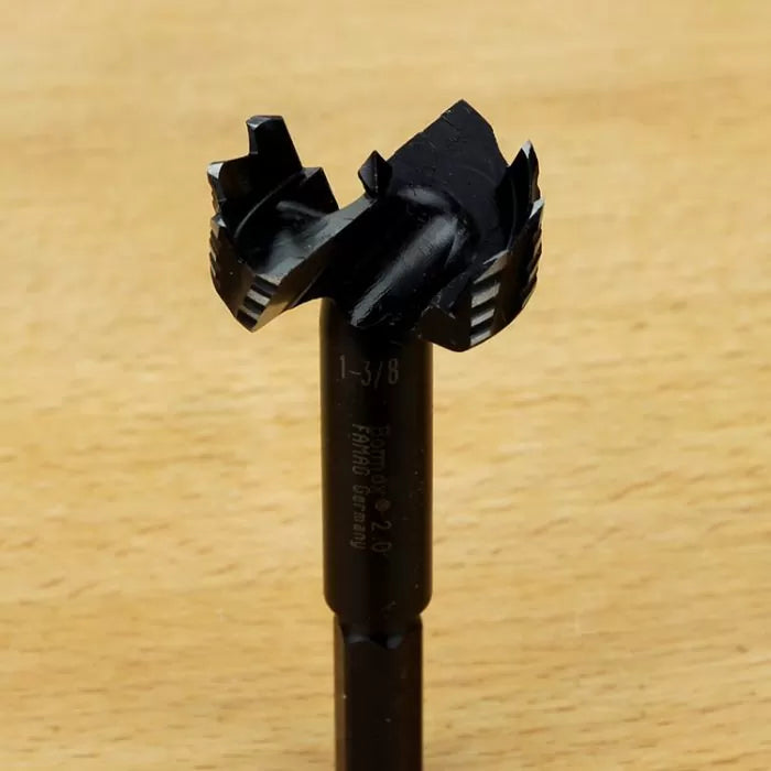 Close-up of a Bormax 2.0 Forstner bit for woodworking on a wooden surface