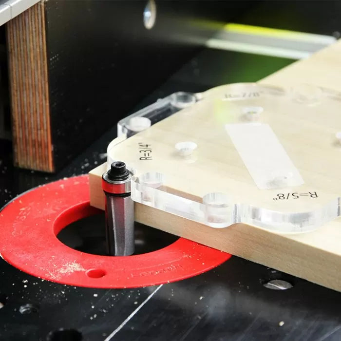 Router table with straight bit cutting wood using clear template for precise joinery