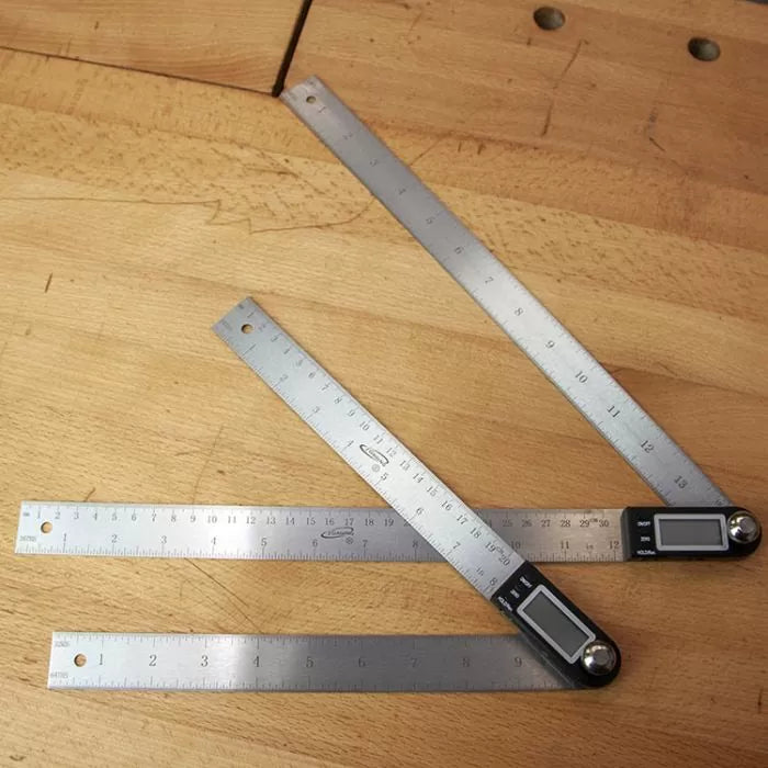 Digital angle rulers with stainless steel blades on wood workbench, woodworking measuring tools