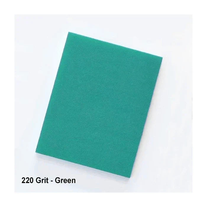 Green 220 grit sanding foam pad on a white background