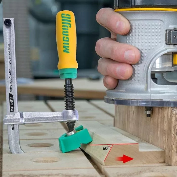 Router and dovetail clamp securing wood at 60 degree angle for precise woodworking