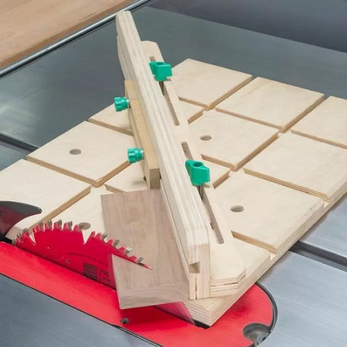 Table saw crosscut sled used for precise woodworking cuts with adjustable fence guide.