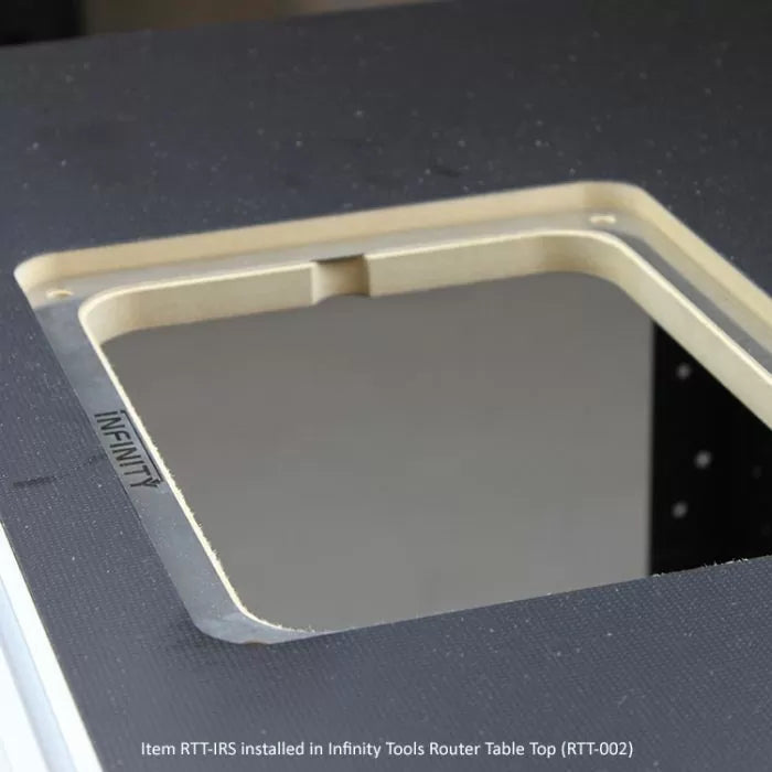 Router table insert installed in a black router table top for woodworking