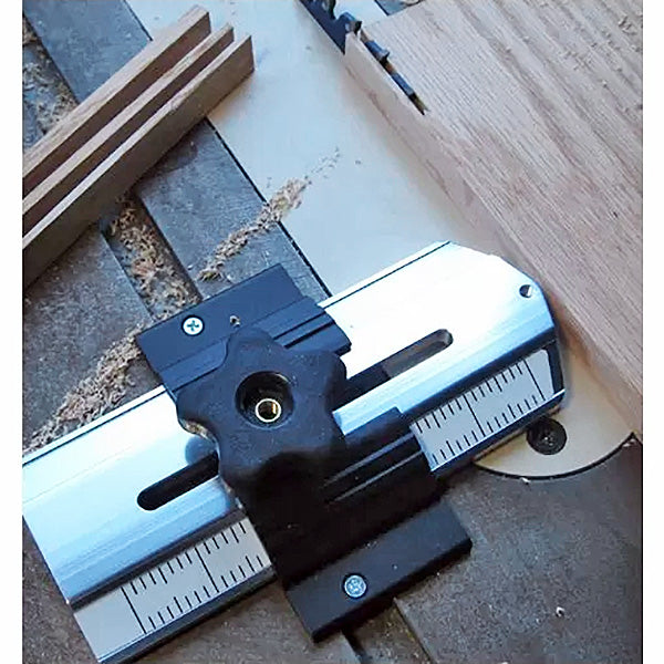 Router table miter gauge with fence, used for precise woodworking cuts