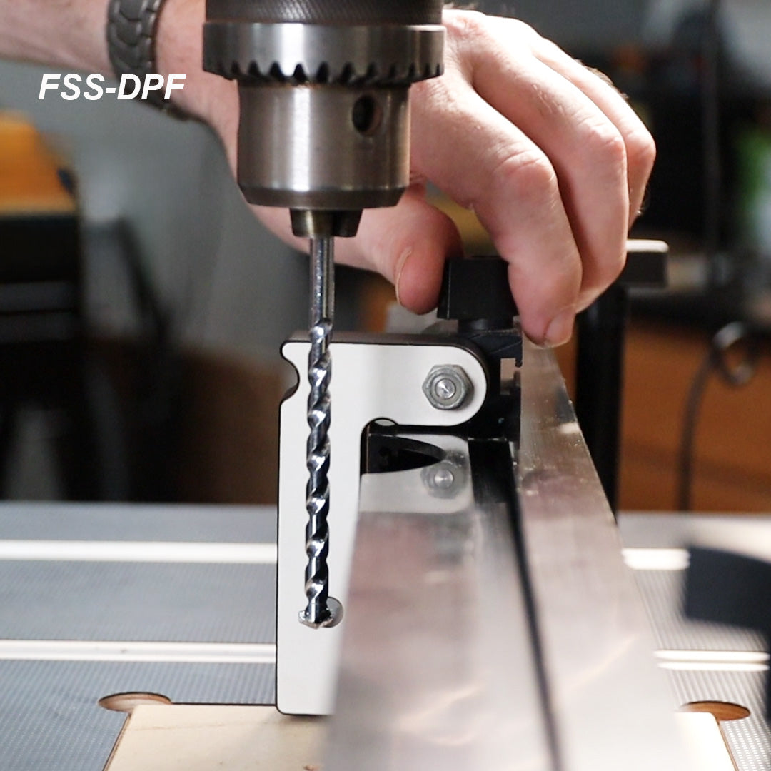 Drill press fence stop accessory in use with drill bit, precise woodworking tool setup