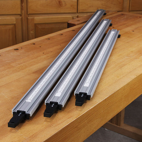 Three Pro-Grip aluminum straight edge clamps on a workbench