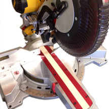 Red miter saw fence extension mounted on a compound miter saw