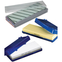 Sharpening stones in blue and clear storage cases