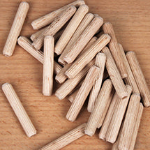 Pile of fluted hardwood dowel pins for dowel joinery