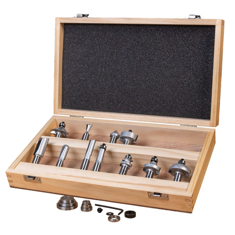 Router bit set in an open wooden storage case with bearings and hex key