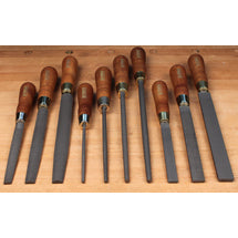 Row of wood-handled rasps and files in assorted shapes and sizes