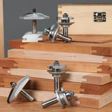 Router bits for woodworking joinery displayed on dovetail jointed wood boards