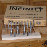 Router bit set with wooden storage case on workbench, ideal for woodworking precision.