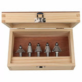 Woodworking router bit set in open wooden case, five metal bits organized in a row