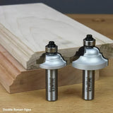 Double Roman ogee router bits with ball bearings displayed beside decorative wood molding