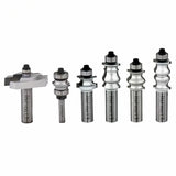 Set of six carbide woodworking router bits with ball bearing guides on white background