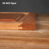 Wood panel with 00-803 ogee edge profile and dovetail joint on a woodworking table